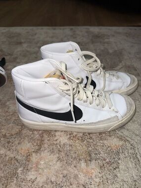 Nike White High-Top Sneakers with Black Swoosh